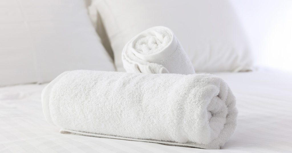 This is Why You Should Leave a Towel By Your Hotel Room Door - Featured image