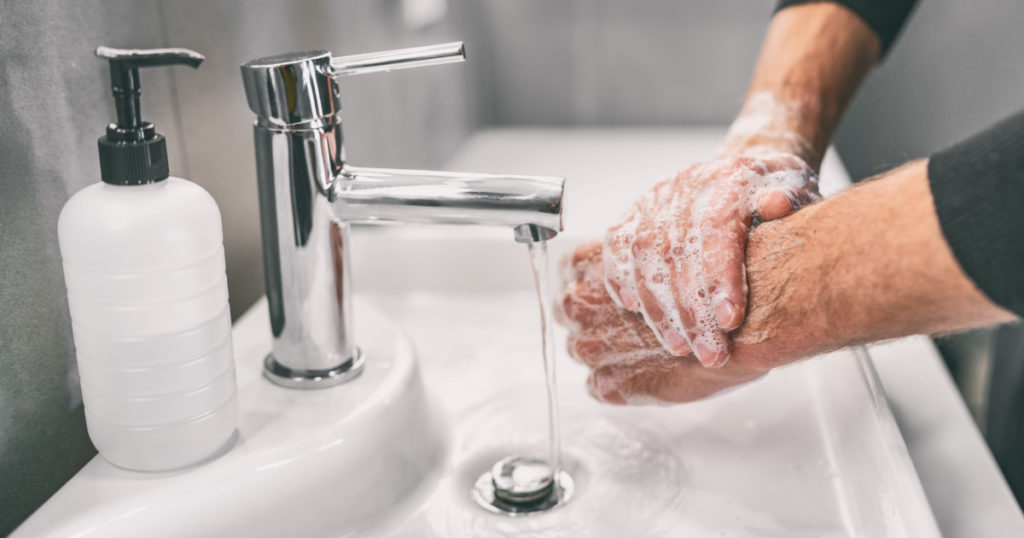 Washing hands rubbing with soap man for corona virus prevention, hygiene to stop spreading coronavirus.
