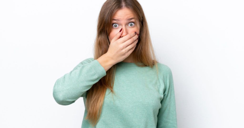 shy woman coveriing face hiding secret things