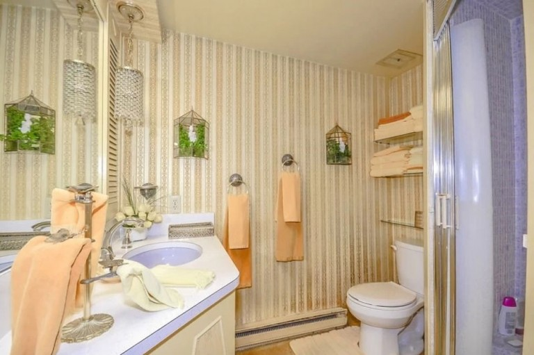 The interplay of lilac and peach in the downstairs bathroom creates a flawless composition, with not a single element out of place.
