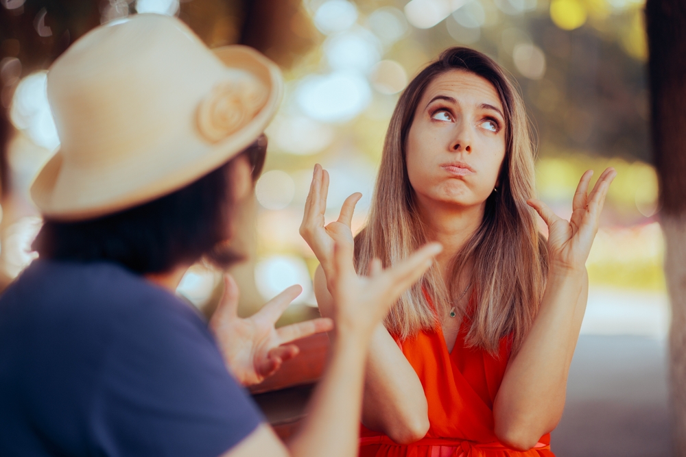 Unhappy Woman Arguing with Her mother in the Park. Disrespectful daughter finding the conversation with her mom boring