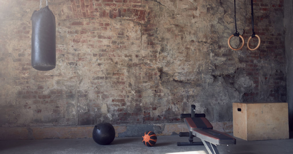 Gym with old brick wall with sports equipment