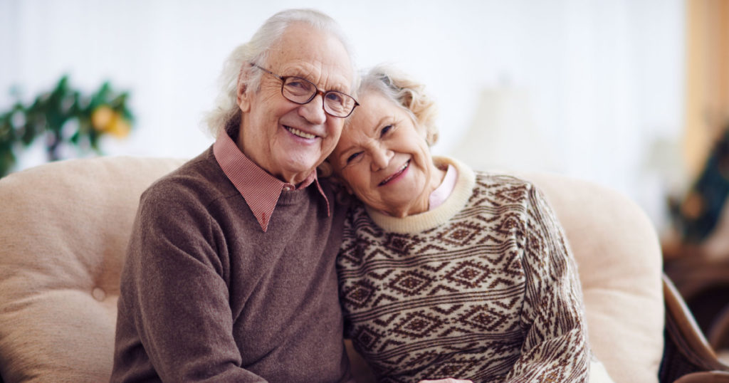 Affectionate grandparents having rest at home