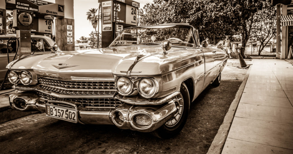 Varadero, Cuba - June 19, 2015: HDR - Cadillac Cabriolet classic car refuel at the gas station - Retro sepia Serie Cuba Reportage