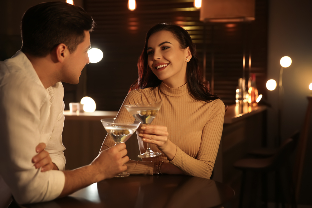 Man and woman flirting with each other in bar