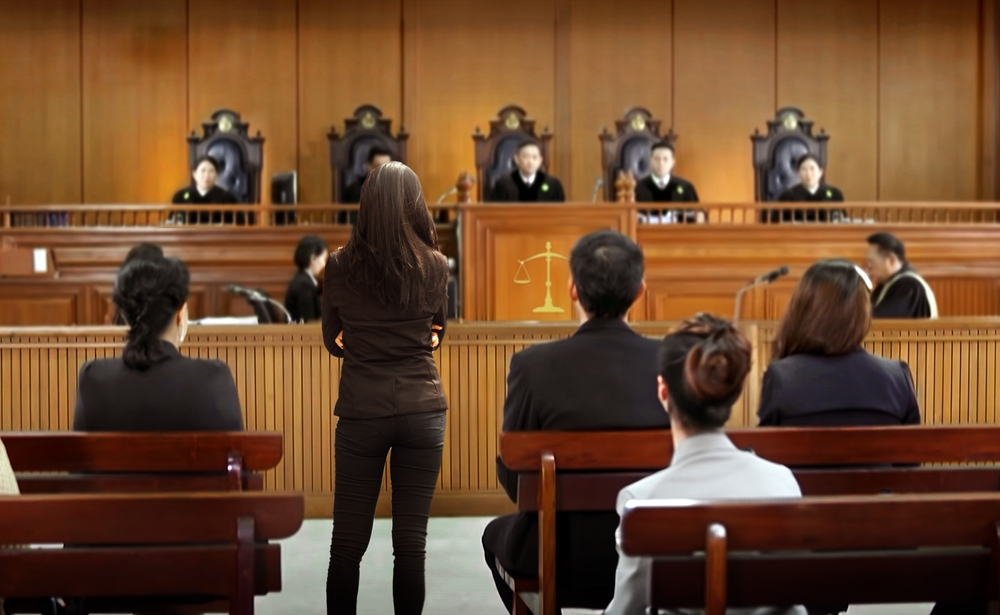 plaintiff or defendant talks to the judge in courtroom. The concept of legal adjustment Court of Justice and Legal Trial Speech to Judge Lawyer Lawyer Protects Client with Argument