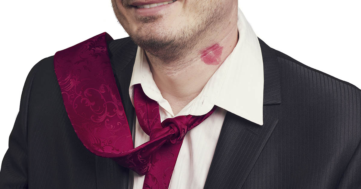 man with lipstick kiss mark on neck