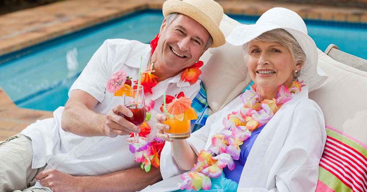 retired couple enjoying time by the pool