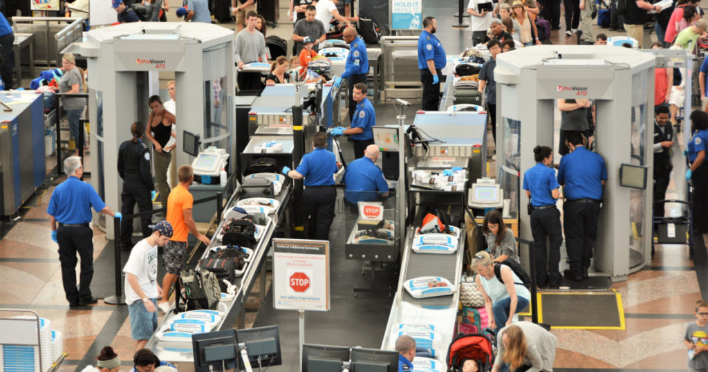 Denver, CO, USA. July 27, 2019. Travelers in long lines at Denver International Airport going thru the Transportation Security Administrations (TSA) security screening areas to get to their flights.