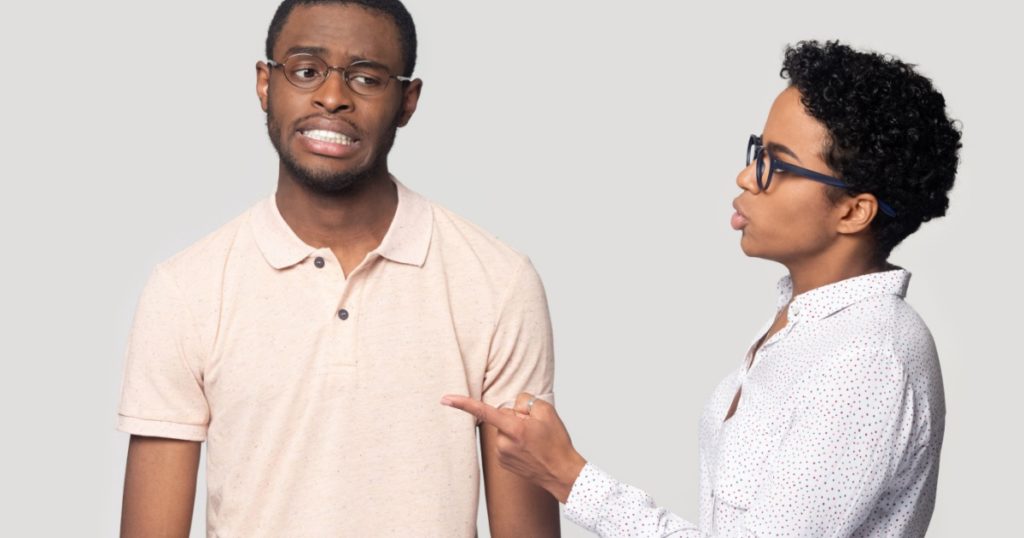 Head shot portrait close up angry girlfriend quarreling with African American boyfriend, young man and woman in glasses, strict teacher talking to unhappy student, isolated on grey background