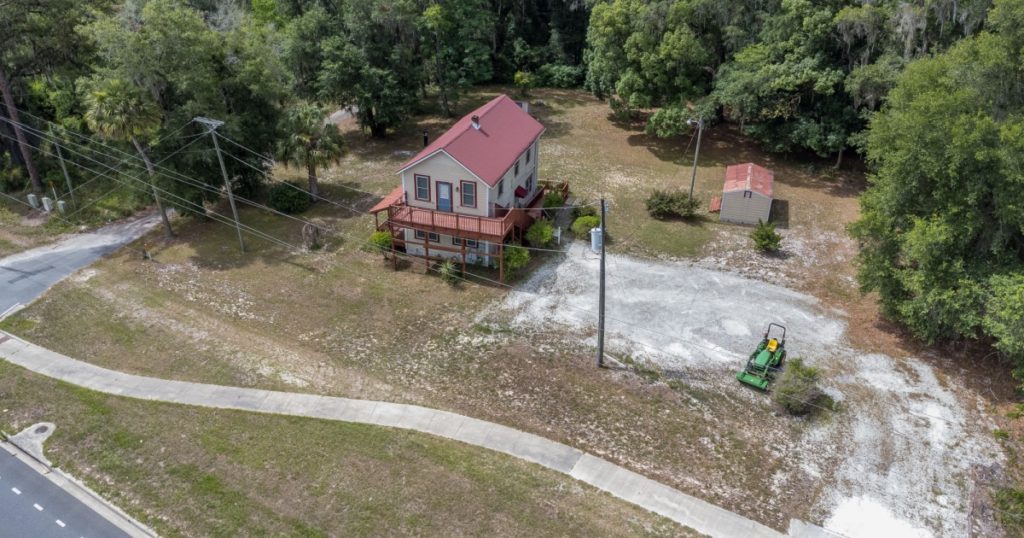 Interlachen, Florida USA - June 25, 2022: Aerial view of a home surrounded by trees