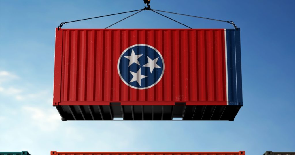 Freight containers with Tennessee flag, clouds background