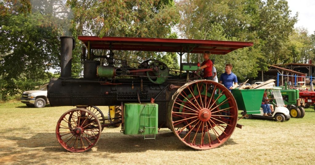 ADAMS, US - Jul 16, 2021: The men with various vintage Case Steam Tractors attending Tennessee Kentucky Threshermen Show 2021