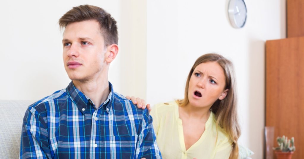 Unpleased person criticizing spouse in room