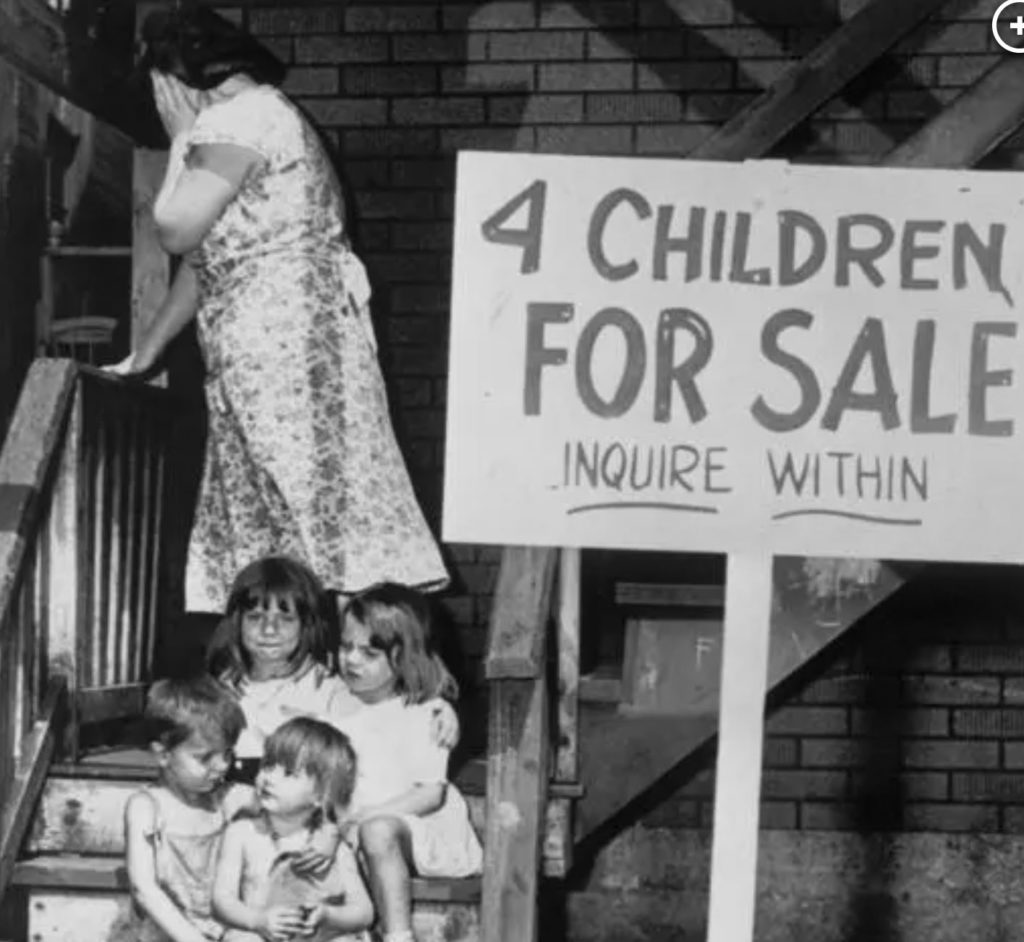 4 children for sale sit on steps with their mother behind them, 