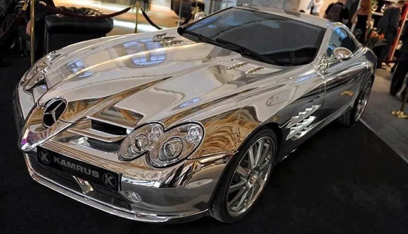 a late-model Mercedes luxuriously coated in pure white gold.