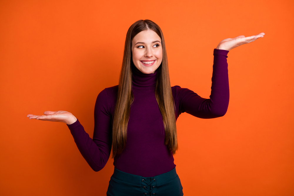 Look sale discounts option. Positive girl promoter hold hand look advert promo indicate great solution wear violet jumper isolated over bright color background