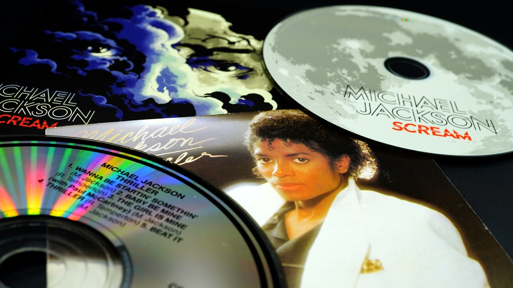 Rome, February 22, 2022: Two CD covers by Michael Jackson. The SCREAM compilation, and the 1982 classic THRILLER one of the best-selling albums in the world produced by Quincy Jones