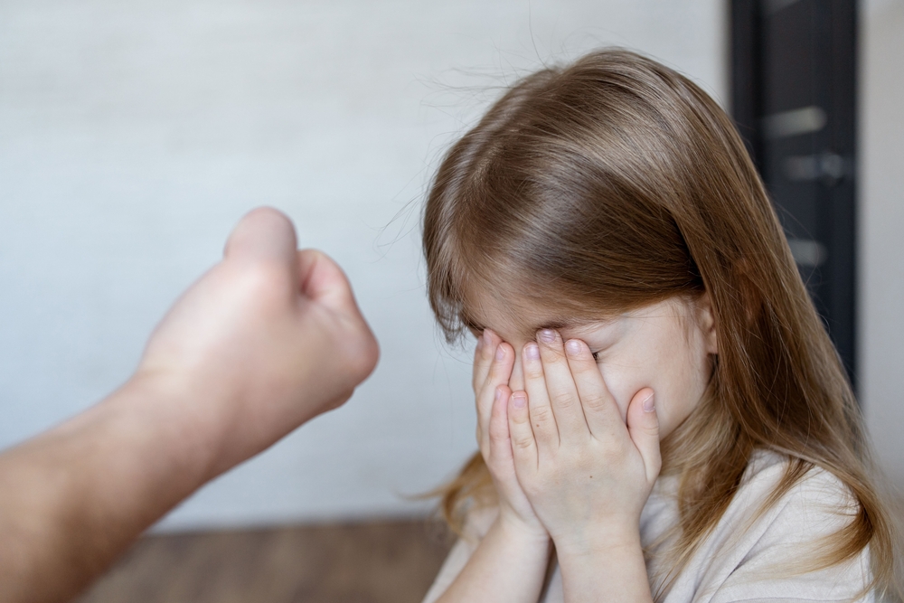 Violence against children. Father scolds and threaten her child girl. family relationships. Discipline, yelling, spanking concept.
