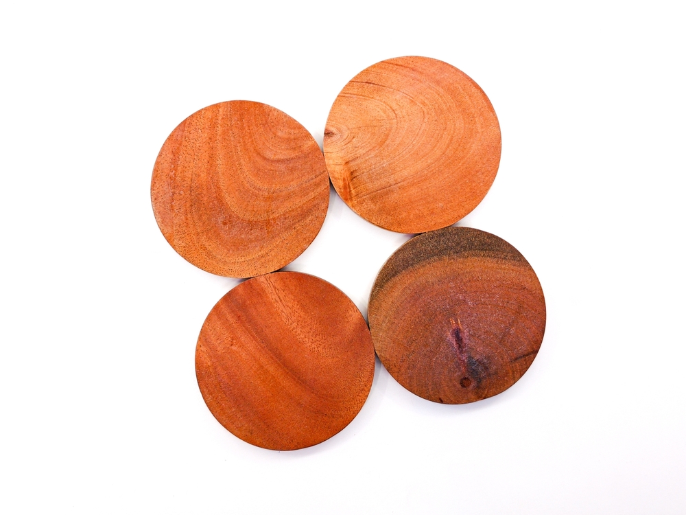 Wooden photo props, wooden trays, wooden coasters, wooden plate for food with a plain white background. Flat lay, top view.