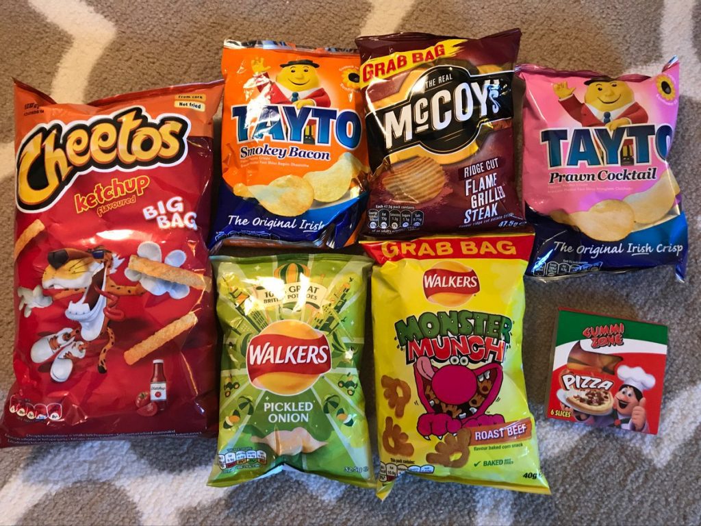 Bags of snacks and chips laid out across the floor