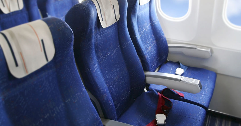 Model Who Called For Planes To Have Bigger Seats Hits Back At Trolls Who Told Her To ‘Buy Two Seats’ - Featured image