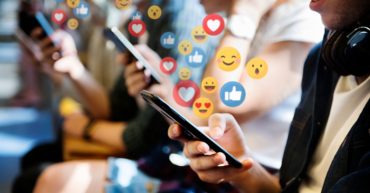 emojis floating out of peoples mobile devices. Social media concept