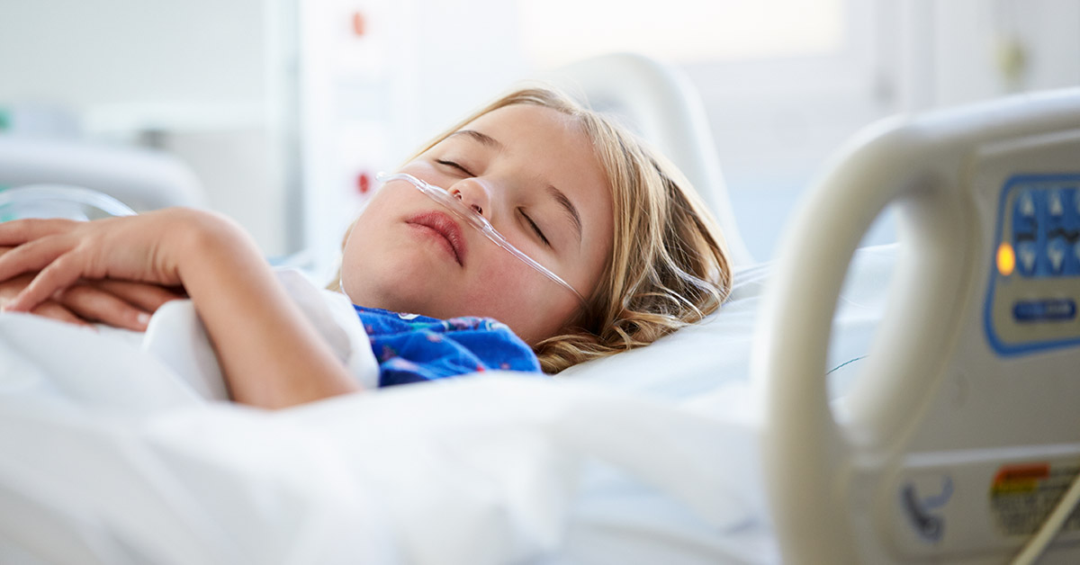 child in hospital bed