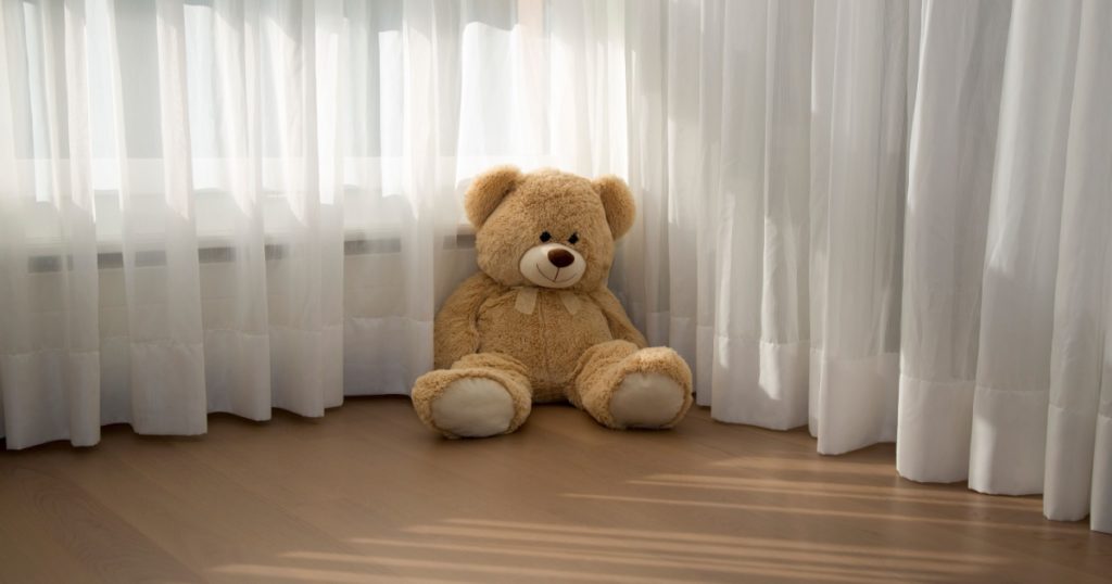 Plush toy - lone Teddy Bear waiting for the children to remember him and come to play