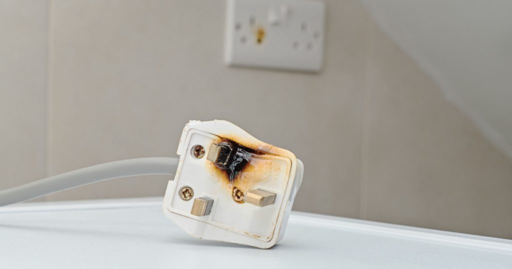 Burned 250V uk style socket and converter. Improper use of AC Power Plugs and Sockets cause of short circuit and fires at home