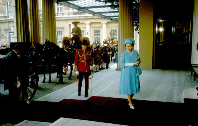 The Queen arrives first at Buckingham Palace for the reception.
