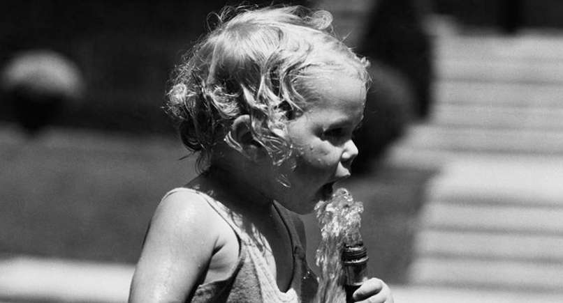 ‘60s kids Drinking Water from Outdoor Hoses