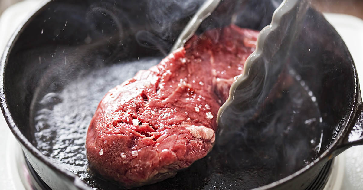 steak in a cast iron pan