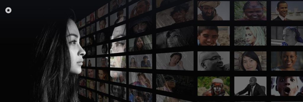 A woman evaluating several images.