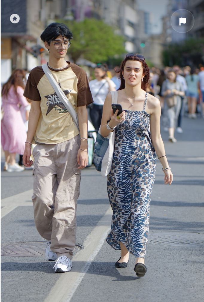 Couple walking across the street.