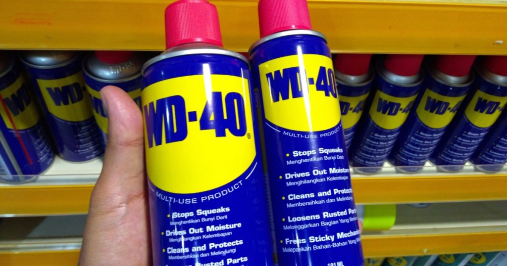 KUALA LUMPUR, MALAYSIA - MARCH 29, 2019: Hand hold WD-40. WD-40 is the trademark name of the penetrating oil and water-displacing spray is now available in Malaysia hardware stores.