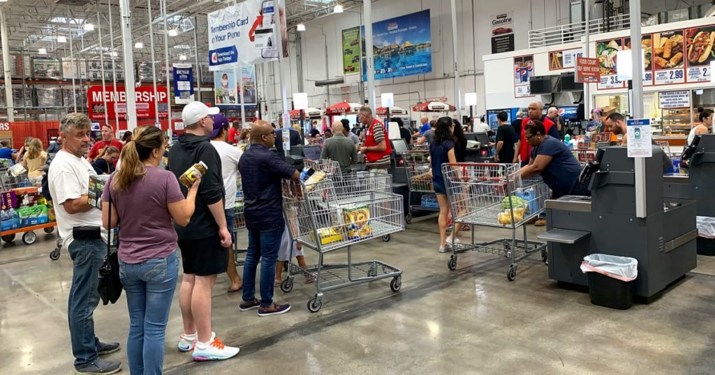 DAVIE, FLORIDA, USA: Customers standing on line to check out of Costco. Costco is an American corporation that operates a chain of members only warehouse clubs as seen on October 26, 2019.