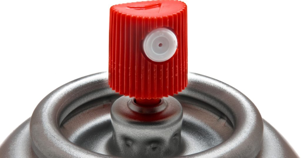 close up of an aerosol can nozzle
