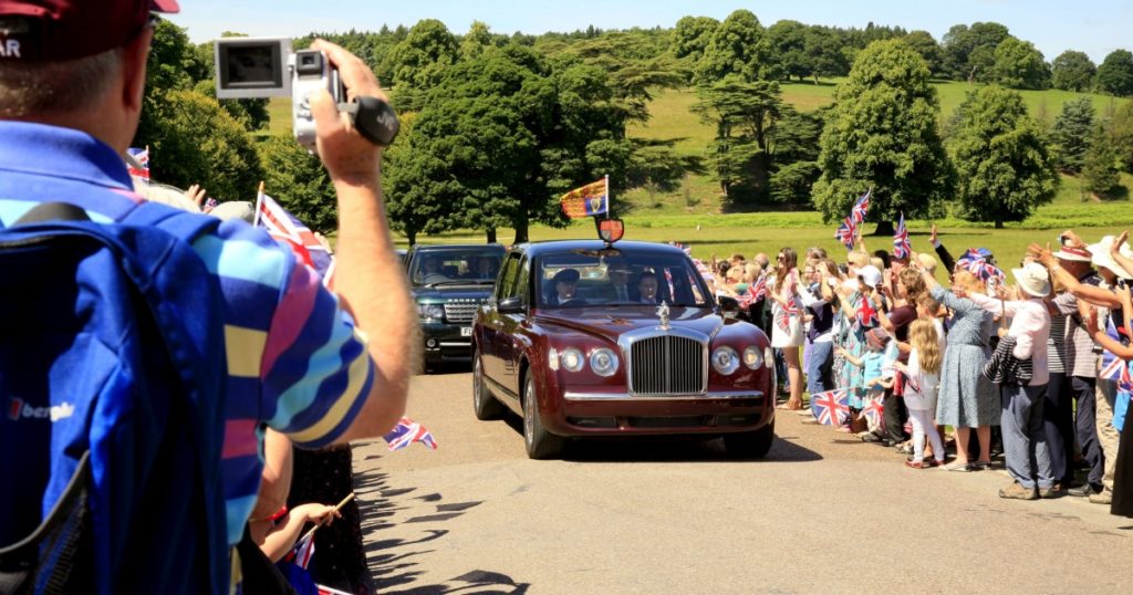 CHATSWORTH, DERBYSHIRE, UK. CIRCA- JULY 10, 2014. The royal car carrying Queen Elizabeth and Prince Philip on a visit to Chatsworth house in