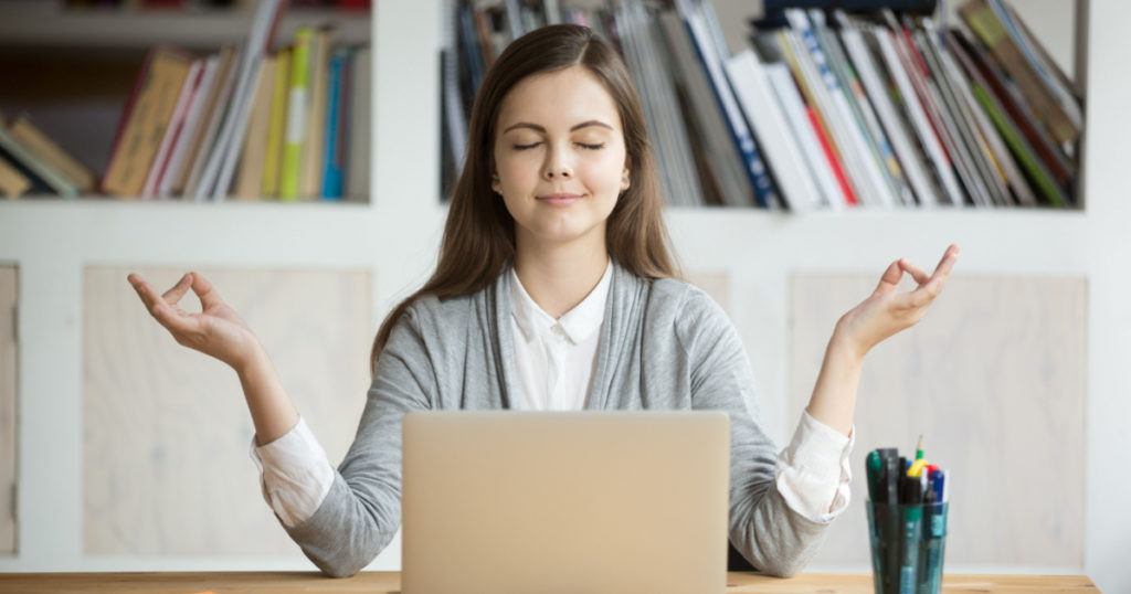 Calm woman relaxing meditating with laptop, no stress free relief at work concept, mindful peaceful young businesswoman or student practicing