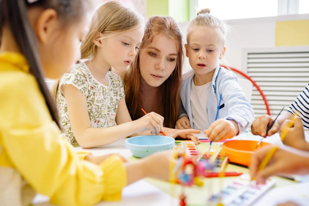 Teacher in classroom with children