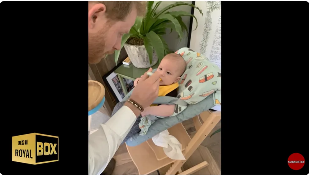 Prince Harry, Duke of Sussex feeds Archie Harrison Mountbatten-Windsor at home from a YouTube video dated December 15, 2022