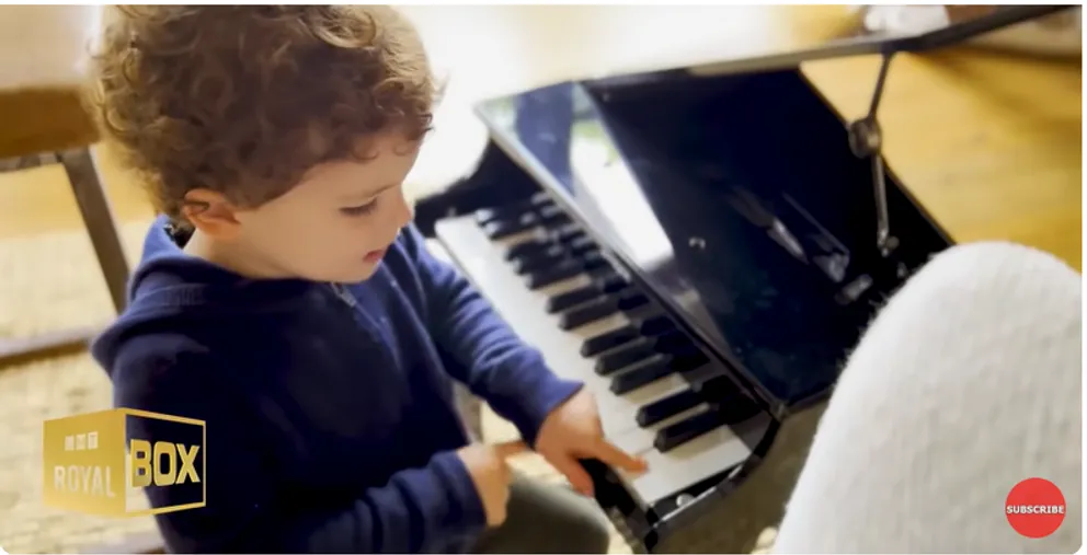 Prince Archie Harrison Mountbatten-Windsor playing the piano at home from a YouTube video dated December 15, 2022