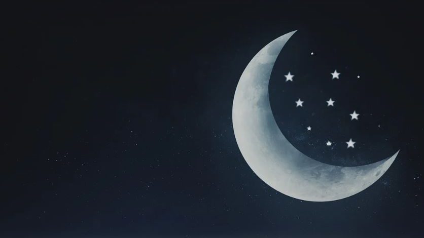 Moon and stars over mountains.