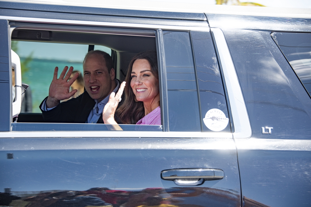 DUNDAS TOWN, THE BAHAMAS - Mar 26, 2022: A closeup shot of Prince William and Kate greeting people from the car
