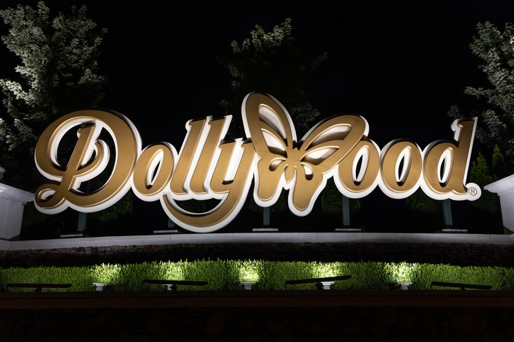 PIGEON FORGE, TN, USA - AUGUST 1, 2022: The entrance to Dollywood with the amusement park logo. Dollywood is Dolly Parton's famous amusement park located in the Smoky Mountains.