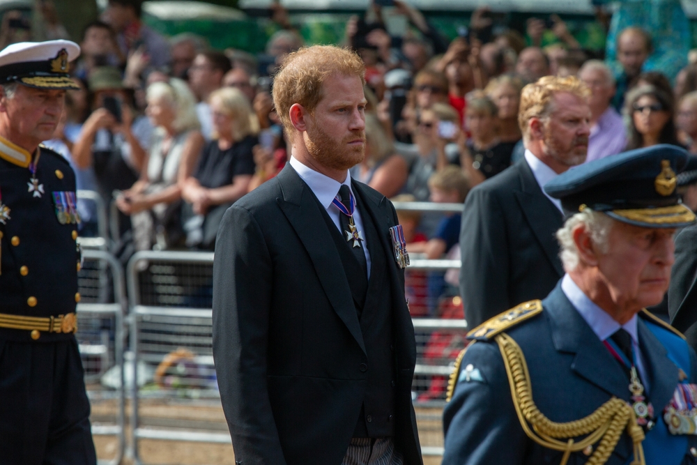London, United Kingdom - September 14 2022: Prince Harry  is seen following the coffin Queen Elizabeth II  on the Mall on its way from Buckingham Palace  to Westminster Hall. 