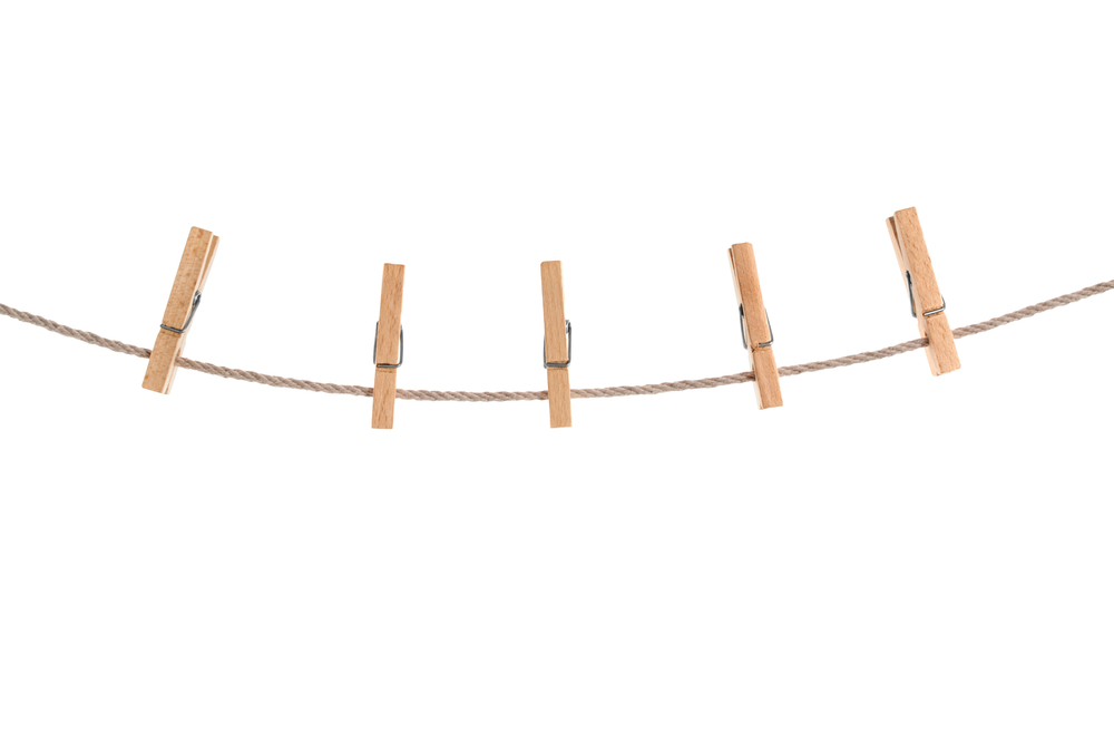 clothespins on rope isolated
