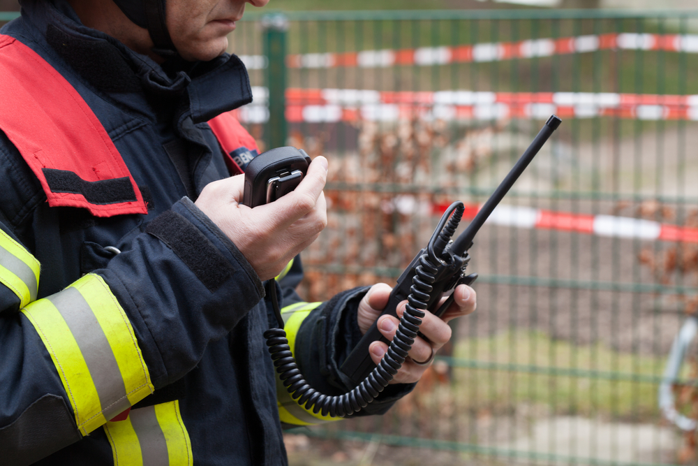 Firefighter used a walkie talkie in action - HDR