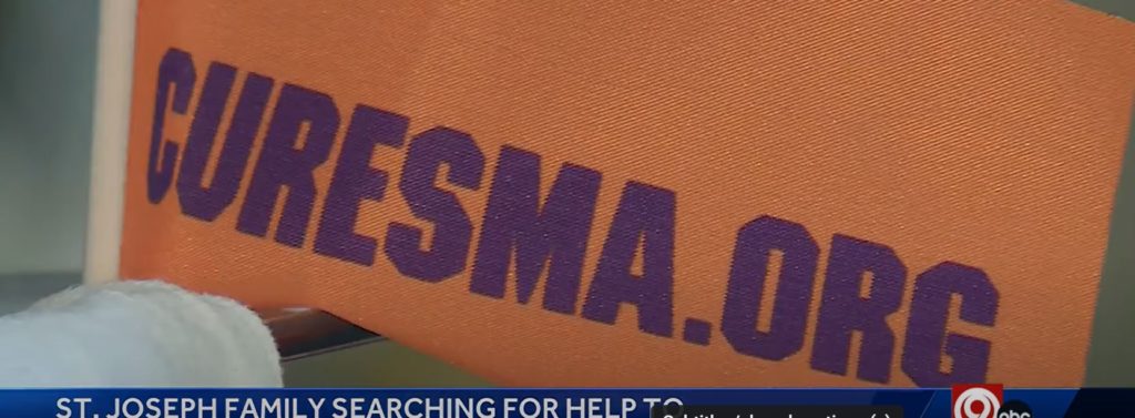 An orange banner with purple writing, detailing a website for SMA.